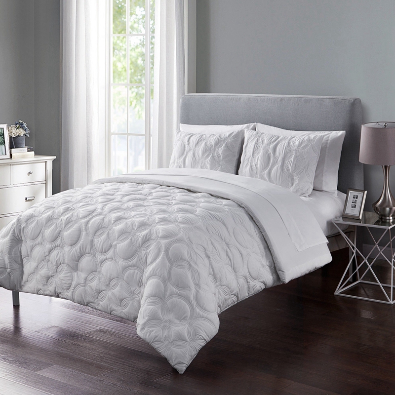 white embossed bed in a big 7 piece set
